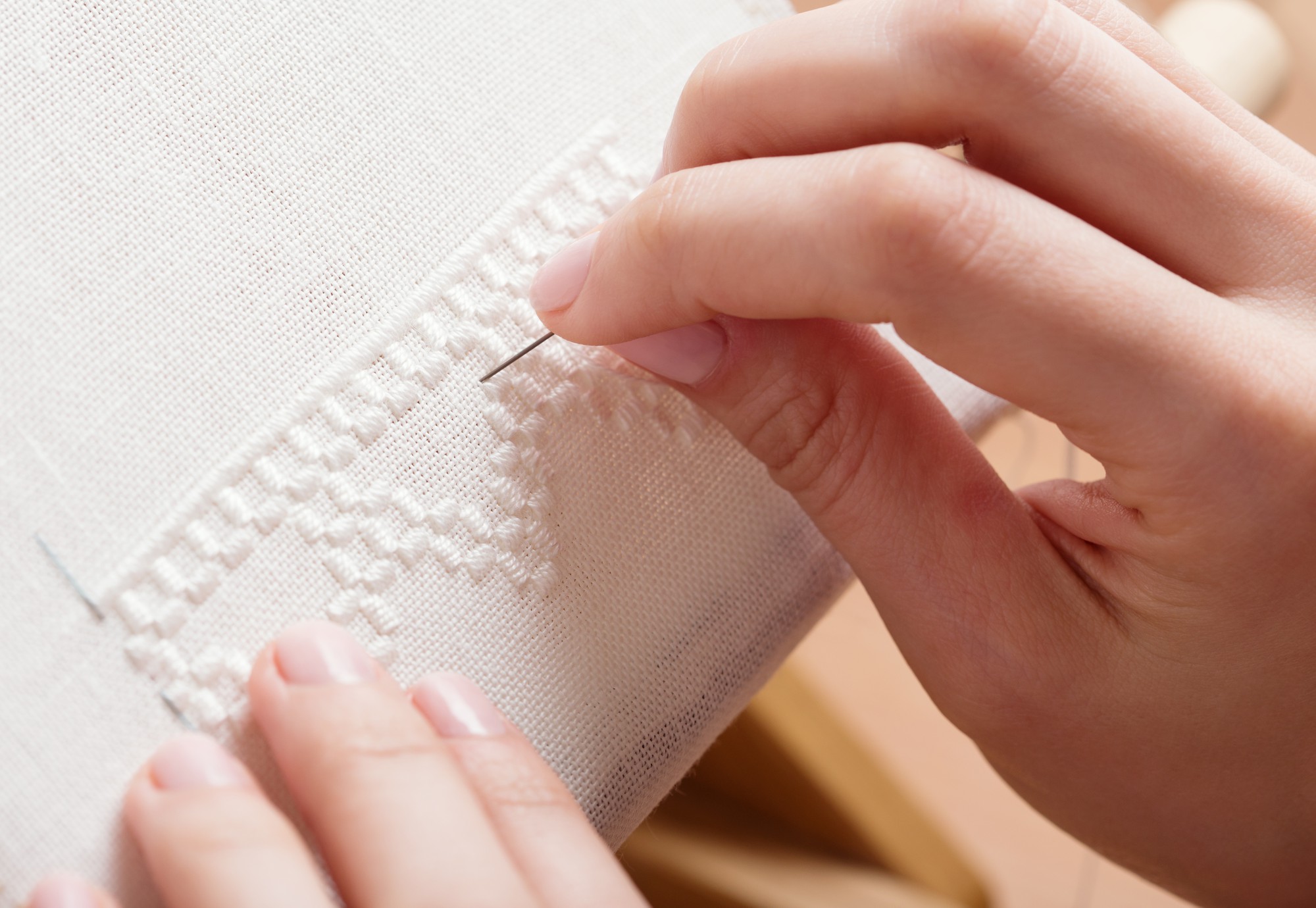 Detail of metallic thread and seed stitches